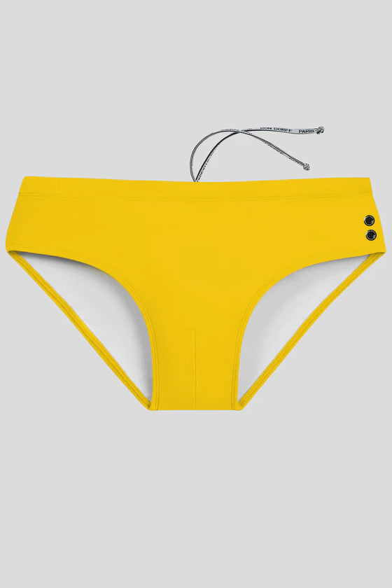 RON DORFF - Yellow swim briefs as worn by Arnold Schwarzenegger.Playboy,  1984. #RonDorff #RDInspirations #RDArchives #Swimwear